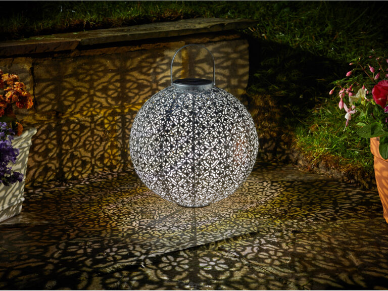 A large, orb like solar lantern with a Moroccan pattern