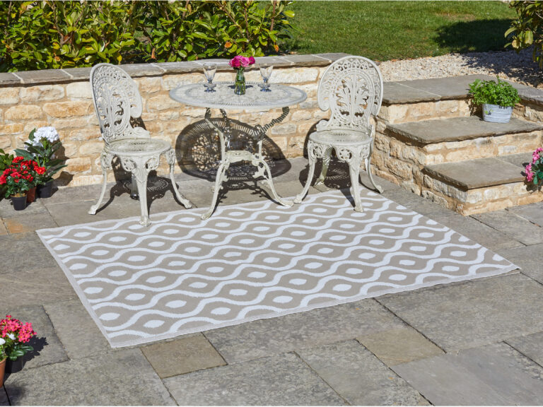 A white and beige patterned outdoor rug